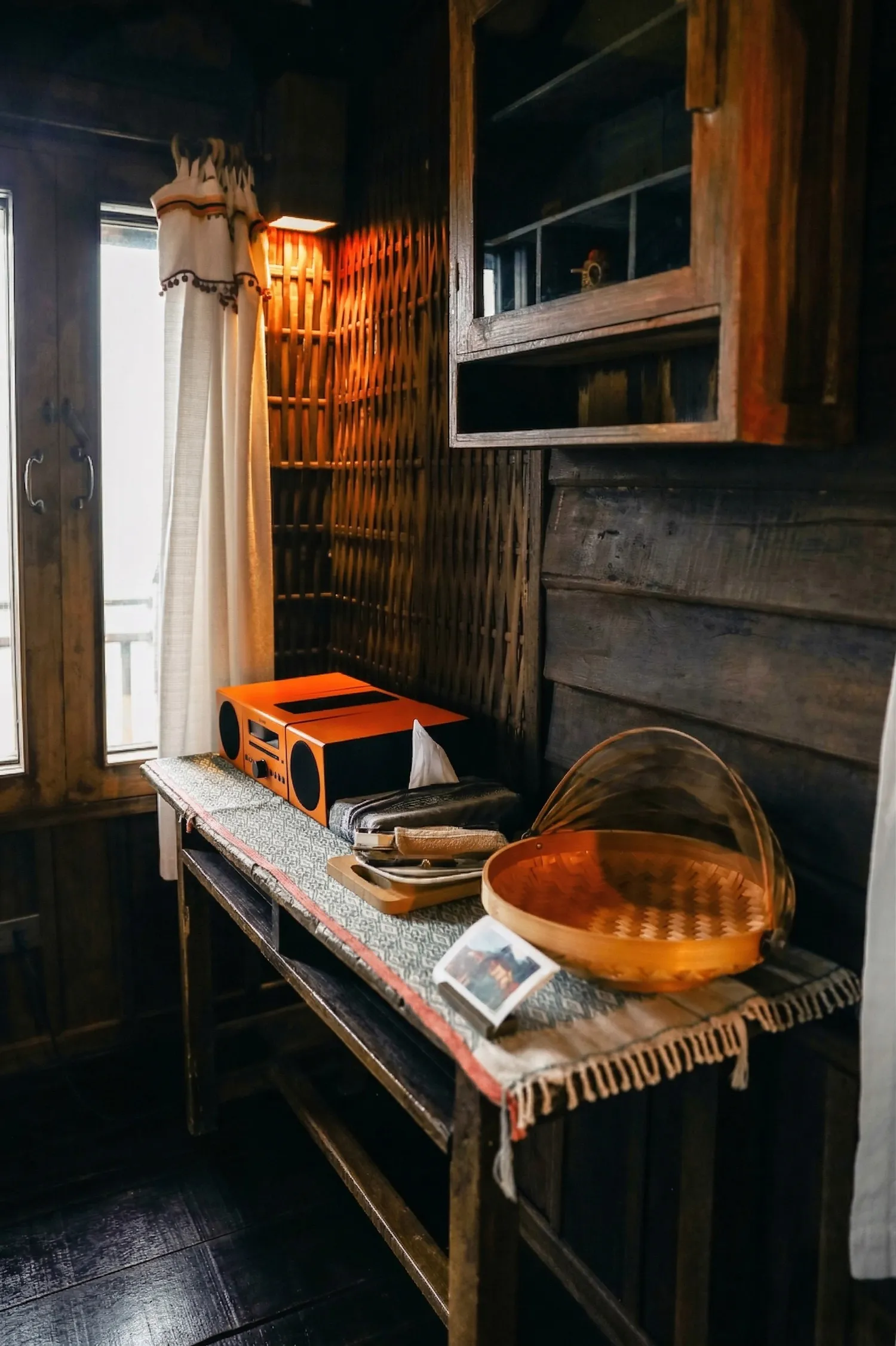 Tea corner by the window at night
